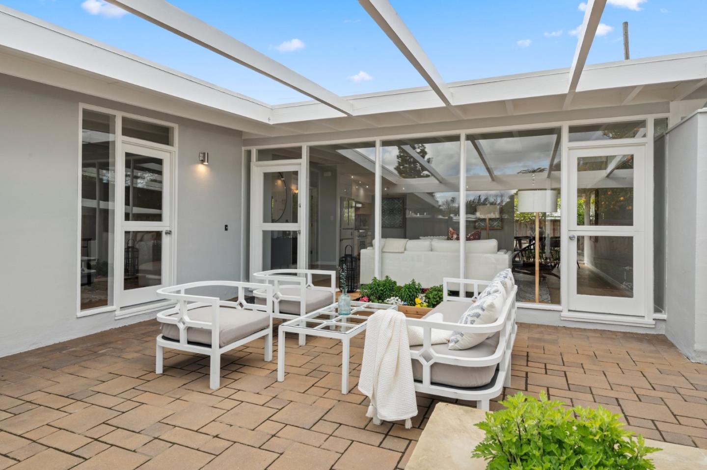 238 Hamilton Avenue Mountain View, CA 94043 - Photo 2 of 18 a view of a patio with table and chairs and potted plants
