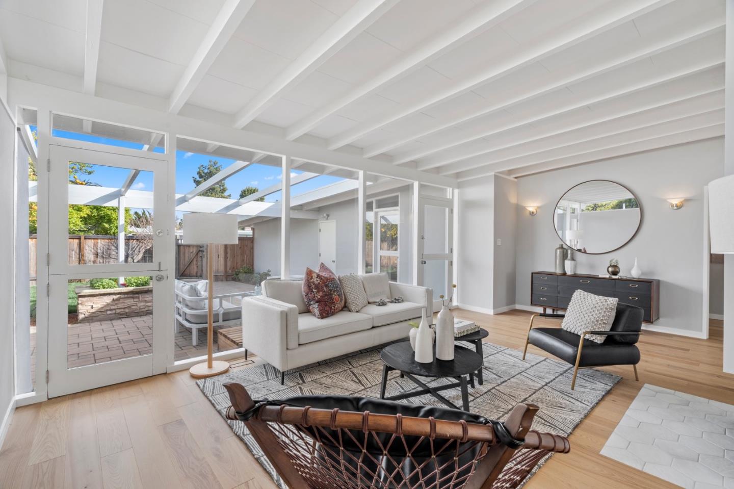 238 Hamilton Avenue Mountain View, CA 94043 - Photo 4 of 18 a living room with furniture a fireplace and a floor to ceiling window