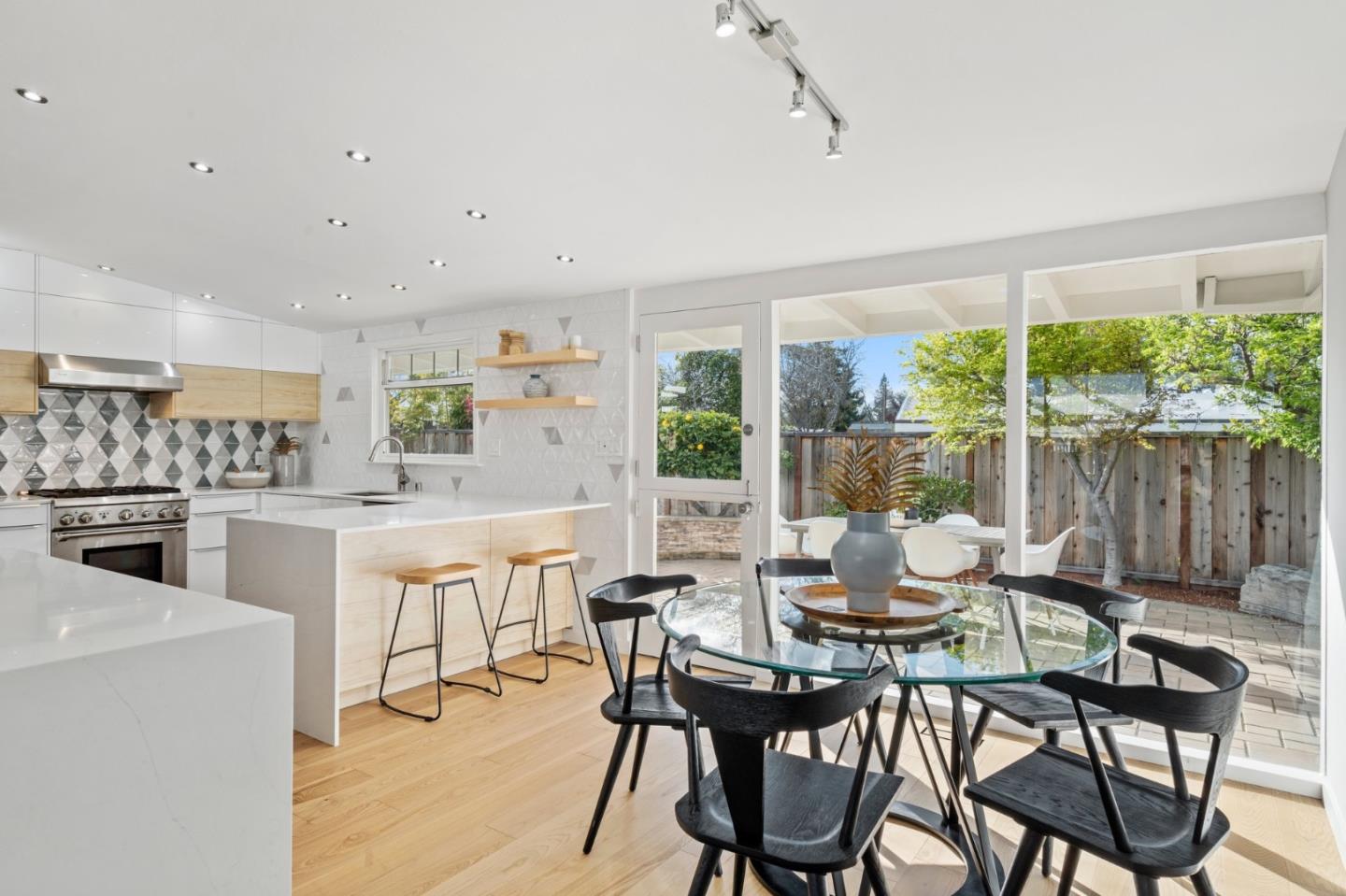 238 Hamilton Avenue Mountain View, CA 94043 - Photo 6 of 18 a dining room with furniture and a floor to ceiling window