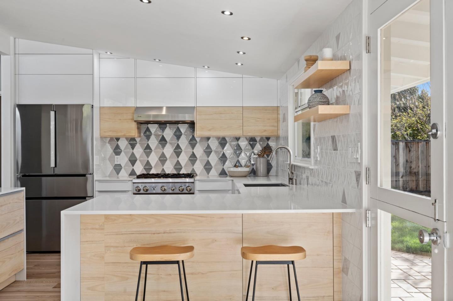 238 Hamilton Avenue Mountain View, CA 94043 - Photo 7 of 18 a kitchen with stainless steel appliances granite countertop a refrigerator and a stove