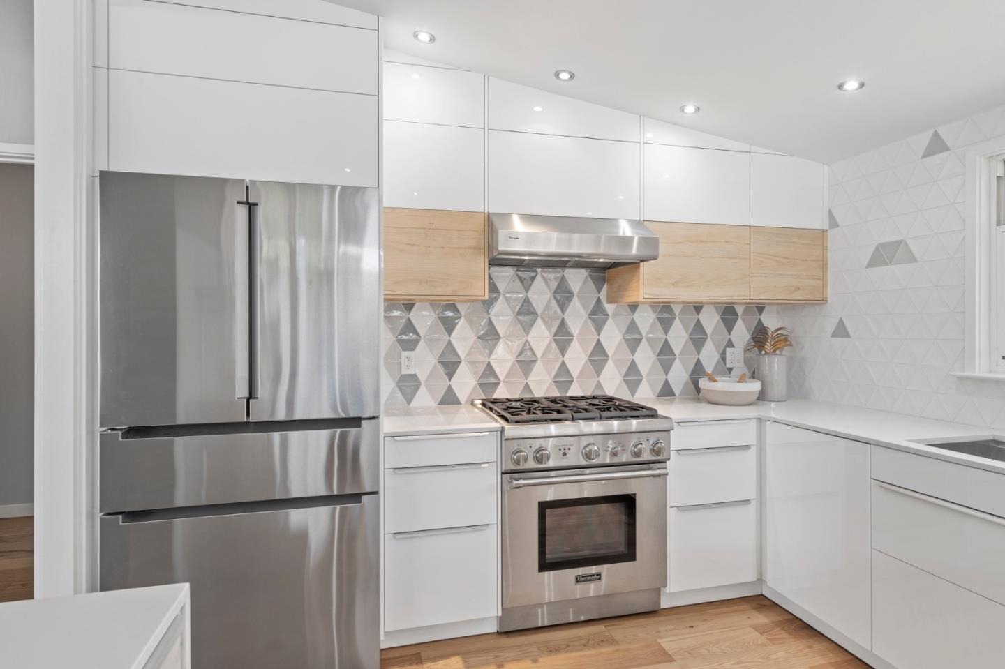 238 Hamilton Avenue Mountain View, CA 94043 - Photo 8 of 18 a stove top oven sitting inside of a kitchen