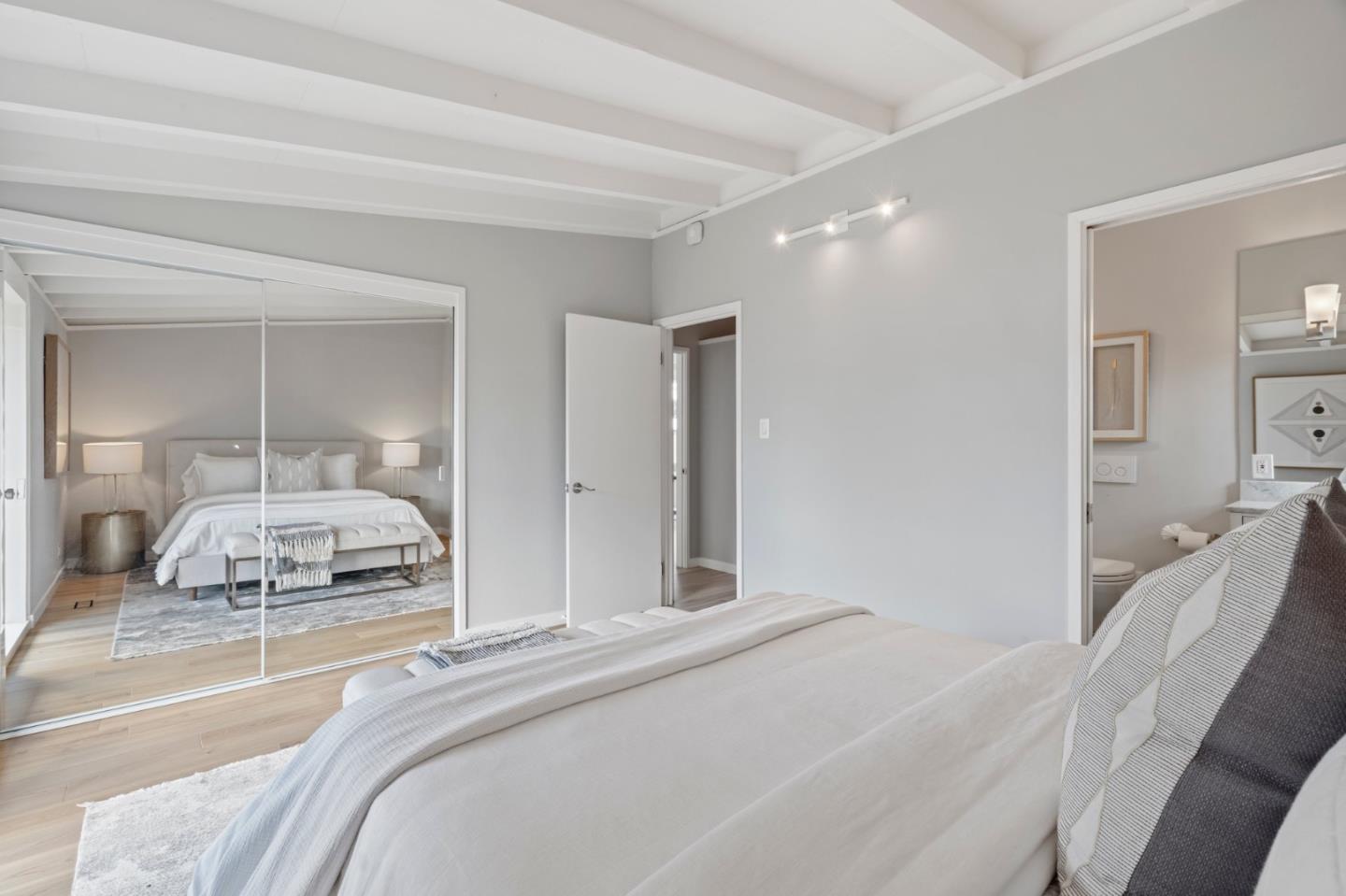 238 Hamilton Avenue Mountain View, CA 94043 - Photo 10 of 18 a bedroom with a bed and a large mirror