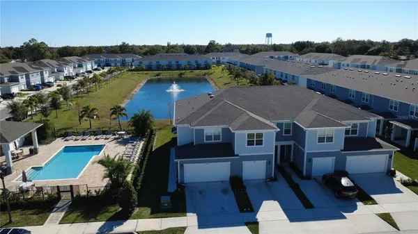 an aerial view of a house with a ocean view