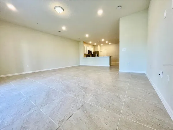 a view of a hallway and a kitchen with a sink
