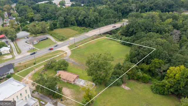 an aerial view of a house with a garden