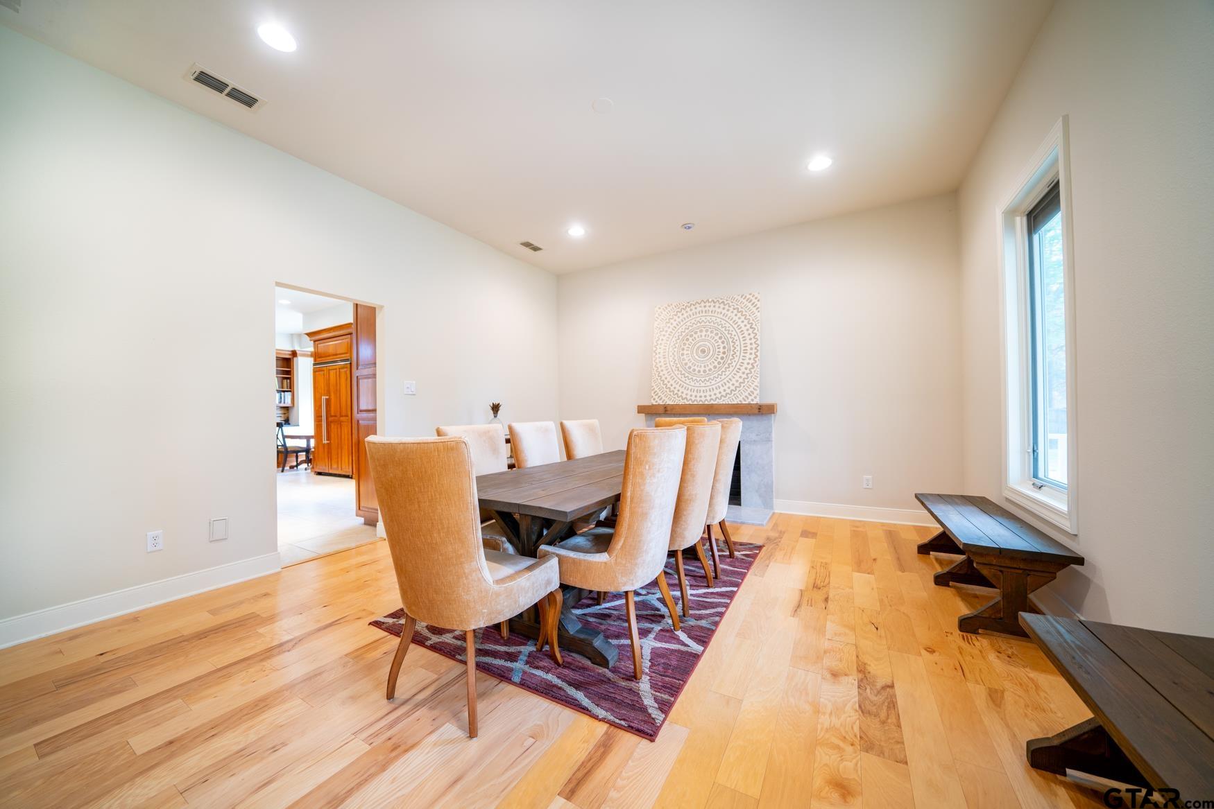 3 Lakeside Drive Longview, TX 75604 - Photo 12 of 41 a view of a dining room with furniture and wooden floor
