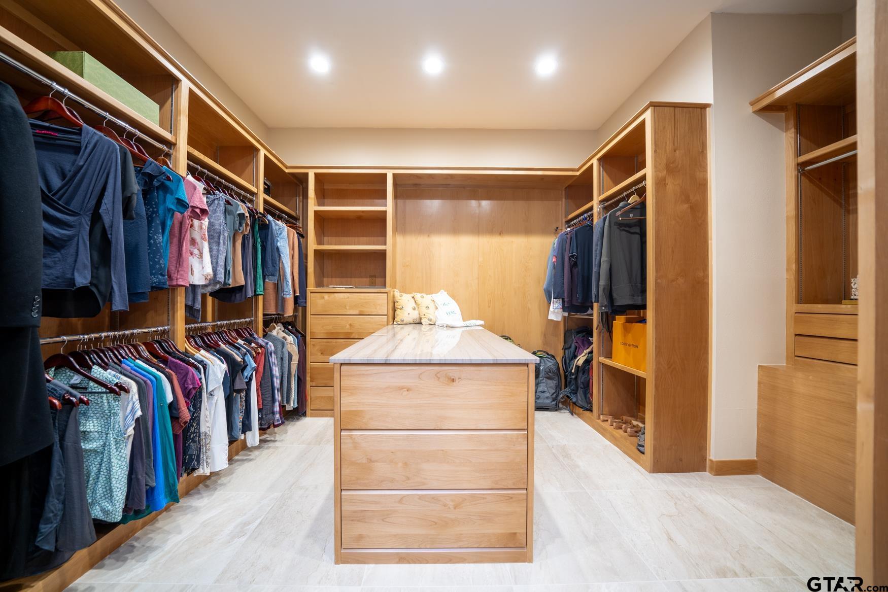 3 Lakeside Drive Longview, TX 75604 - Photo 20 of 41 a view of walk in closet with clothes and shoes