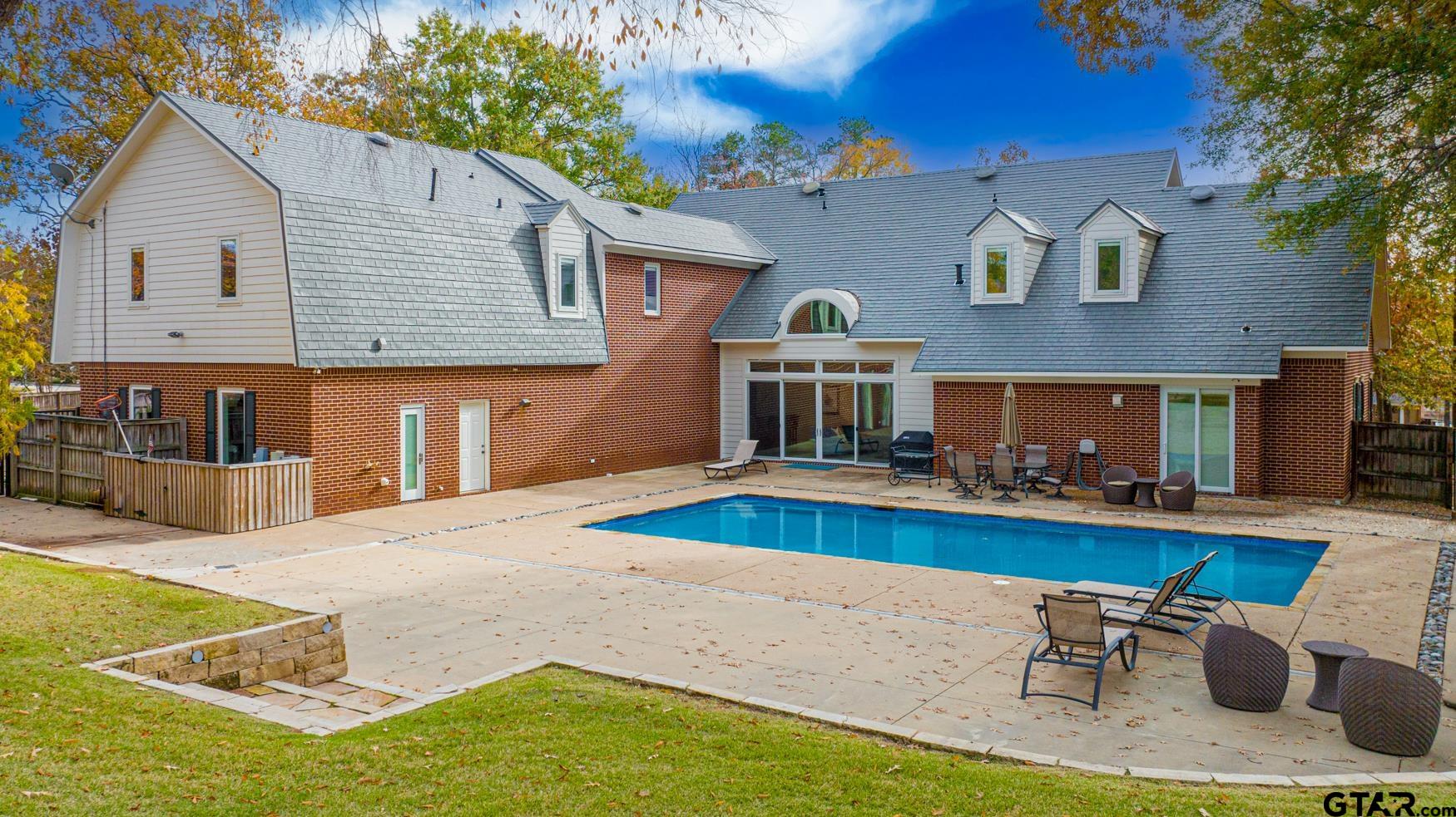 3 Lakeside Drive Longview, TX 75604 - Photo 2 of 41 a view of a house with pool and chairs