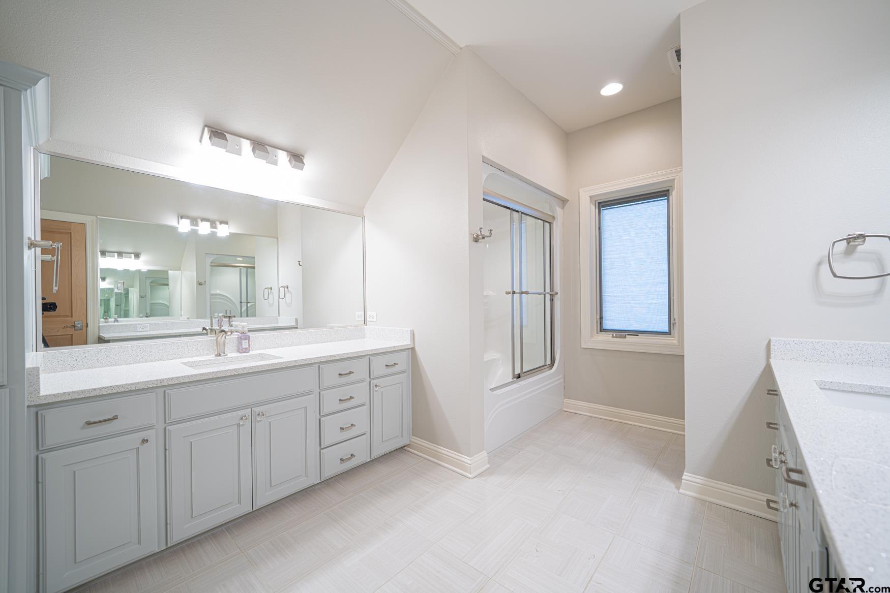 3 Lakeside Drive Longview, TX 75604 - Photo 32 of 41 a bathroom with a granite countertop sink mirror and