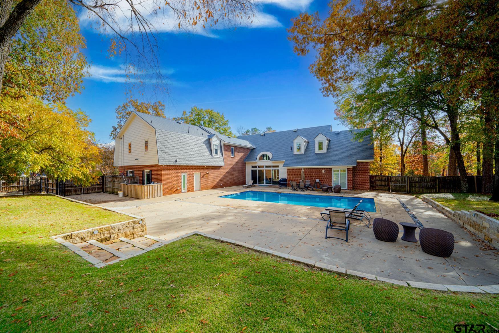 3 Lakeside Drive Longview, TX 75604 - Photo 35 of 41 a swimming pool with outdoor seating and yard
