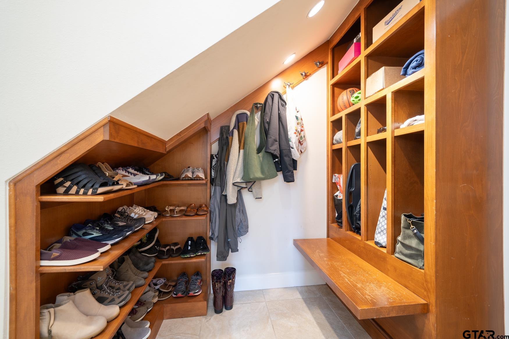 3 Lakeside Drive Longview, TX 75604 - Photo 39 of 41 a view of walk in closet with clothes and shoes