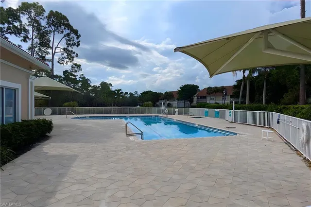 a view of a swimming pool with a patio