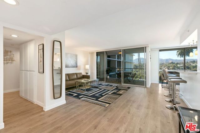 a room with wooden floor and furniture