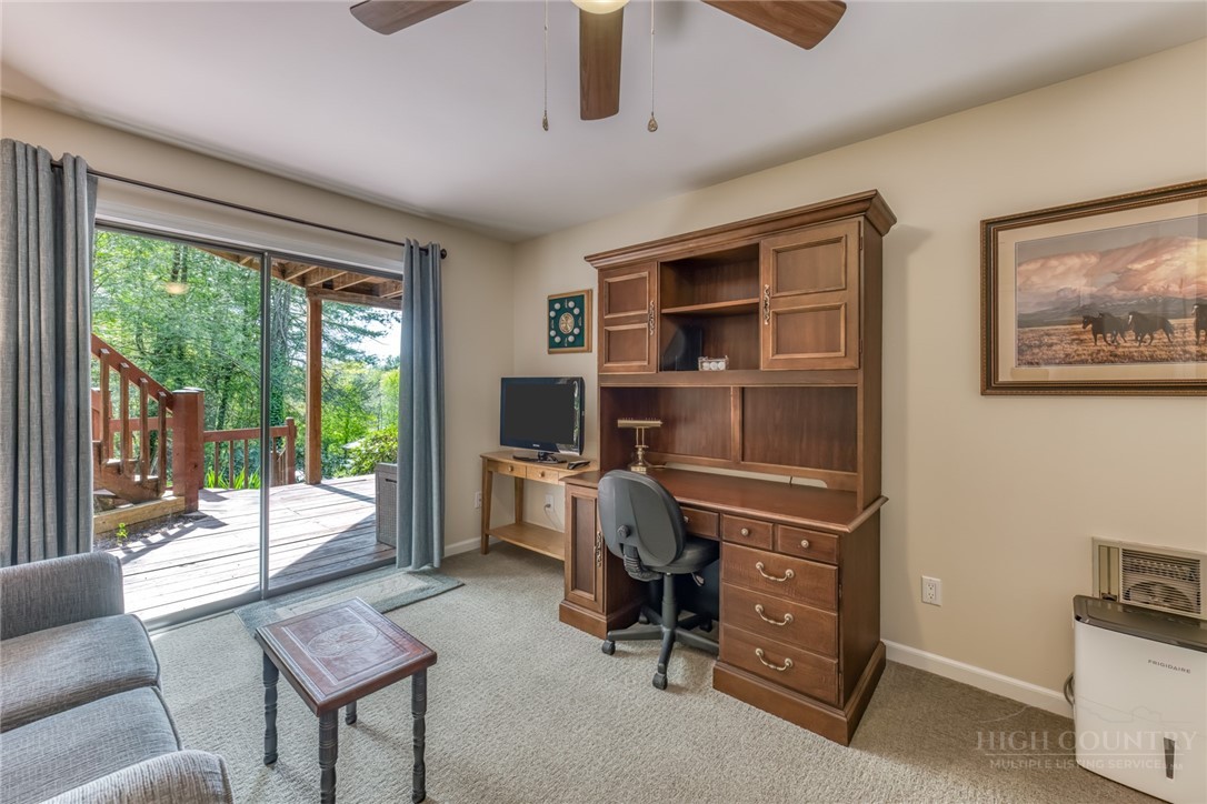 174 Spruce Pine Road Newland, NC 28657 - Photo 32 of 50 a view of a livingroom with workspace and a window
