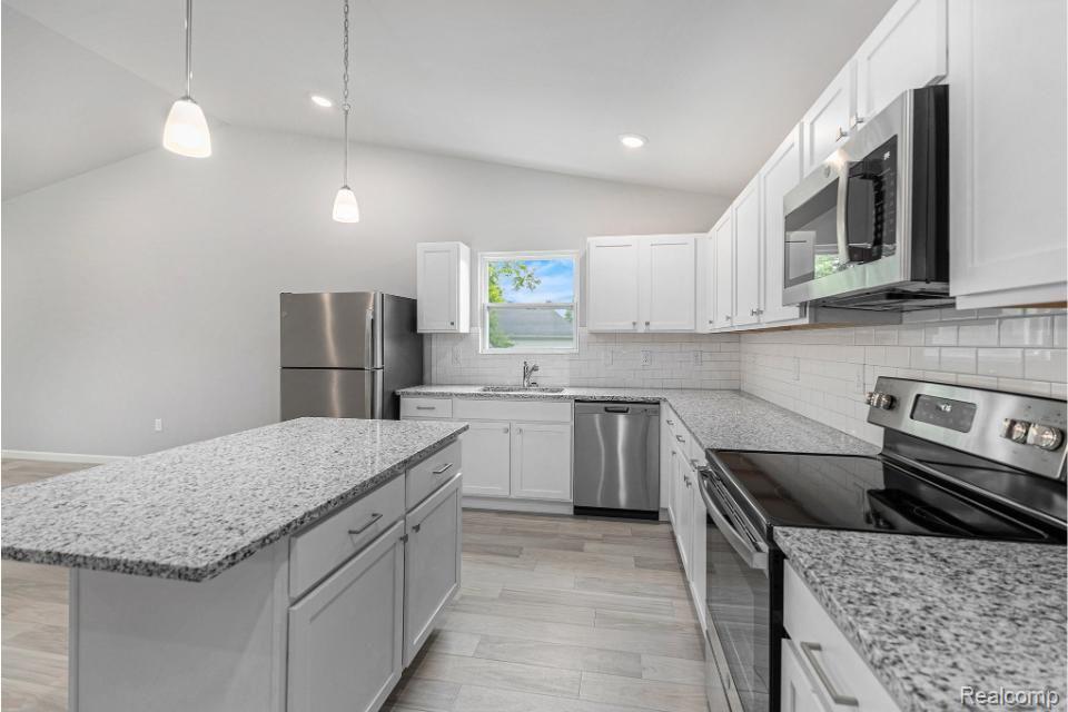 250 Joy Road Adrian, MI 49221 - Photo 7 of 32 Sleek, bright white kitchen with upgrades