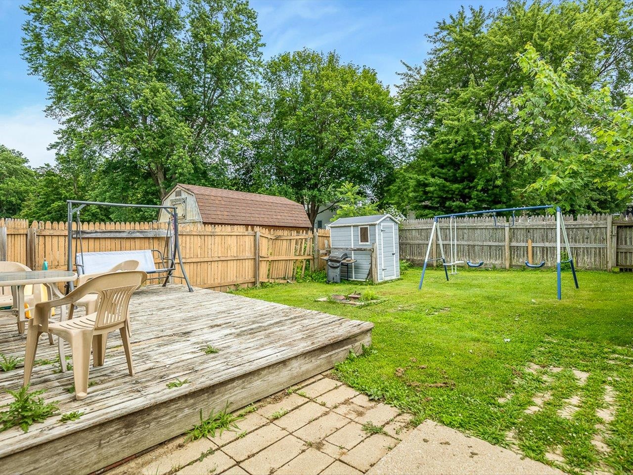 1247 West Logan Street Freeport, IL 61032 - Photo 25 of 34 a view of a backyard with sitting area