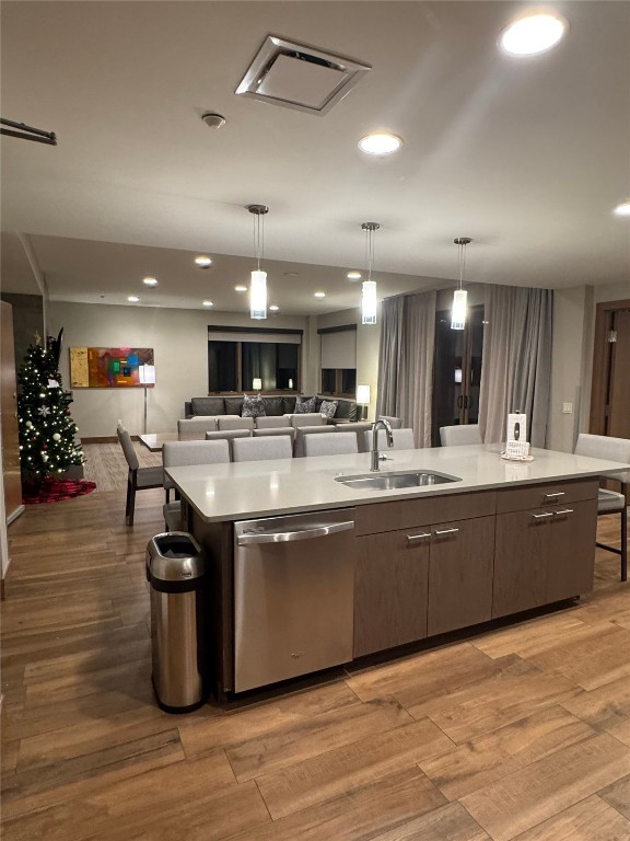 a large kitchen with stainless steel appliances lots of counter space and a sink