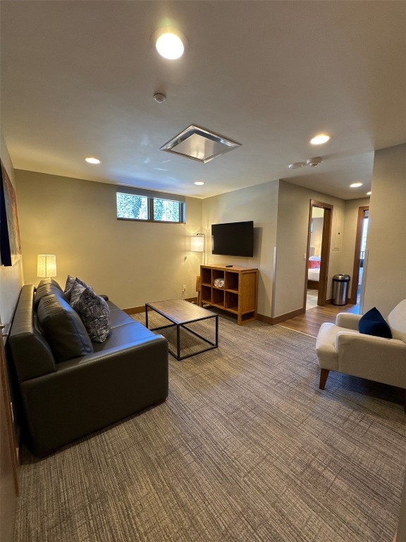 1627 Ski Hill Road, Unit 2236EGHI Breckenridge, CO 80424 - Photo 20 of 23 a living room with furniture and a flat screen tv