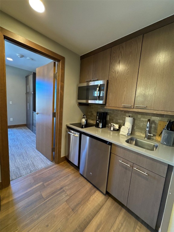 1627 Ski Hill Road, Unit 2236EGHI Breckenridge, CO 80424 - Photo 21 of 23 a kitchen with sink cabinets and wooden floor