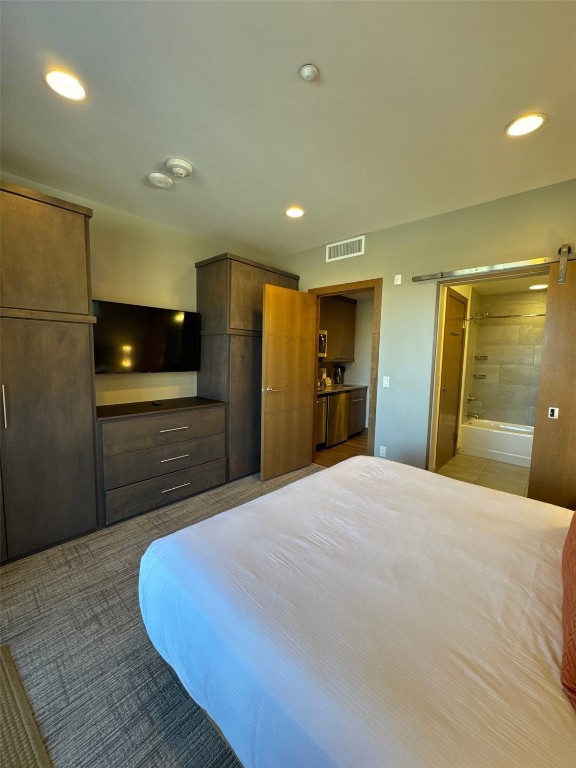 1627 Ski Hill Road, Unit 2236EGHI Breckenridge, CO 80424 - Photo 22 of 23 a large bedroom with a bed and a large mirror