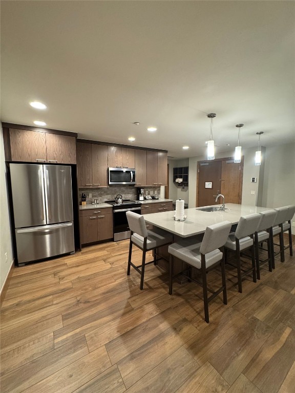 1627 Ski Hill Road, Unit 2236EGHI Breckenridge, CO 80424 - Photo 3 of 23 a kitchen with stainless steel appliances kitchen island granite countertop a table chairs sink and cabinets