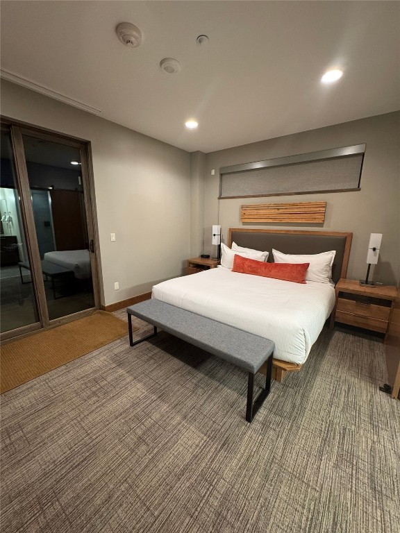 1627 Ski Hill Road, Unit 2236EGHI Breckenridge, CO 80424 - Photo 6 of 23 a bedroom with a bed and a table