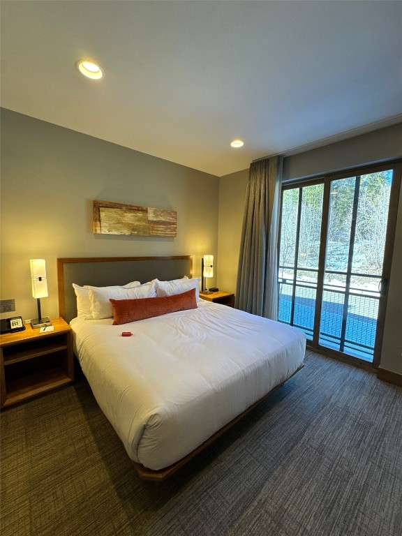 1627 Ski Hill Road, Unit 2236EGHI Breckenridge, CO 80424 - Photo 7 of 23 a bed sitting in a bedroom next to a window