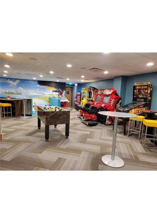 1627 Ski Hill Road, Unit 2236EGHI Breckenridge, CO 80424 - Photo 10 of 23 a living room with stainless steel appliances kitchen island dining table and chairs