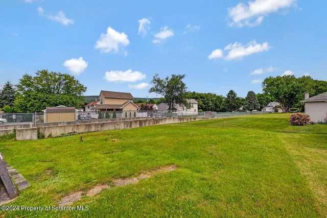 a front view of a house with yard