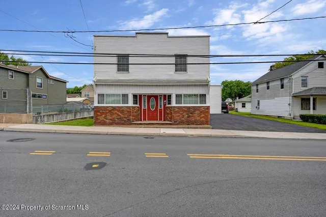 a view of a street with buildings