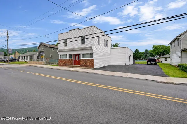 a view of a livingroom with wooden floor