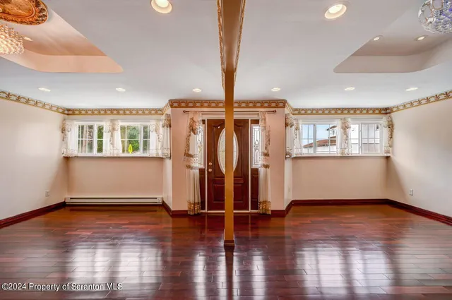 a view of livingroom with kitchen island furniture and a chandelier