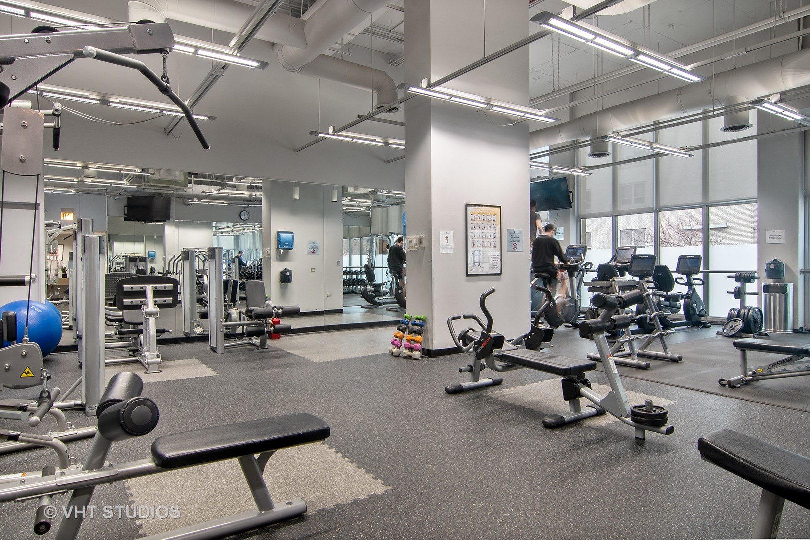 655 West Irving Park Road, Unit 910 Chicago, IL 60613 - Photo 12 of 14 a view of a room with gym equipment