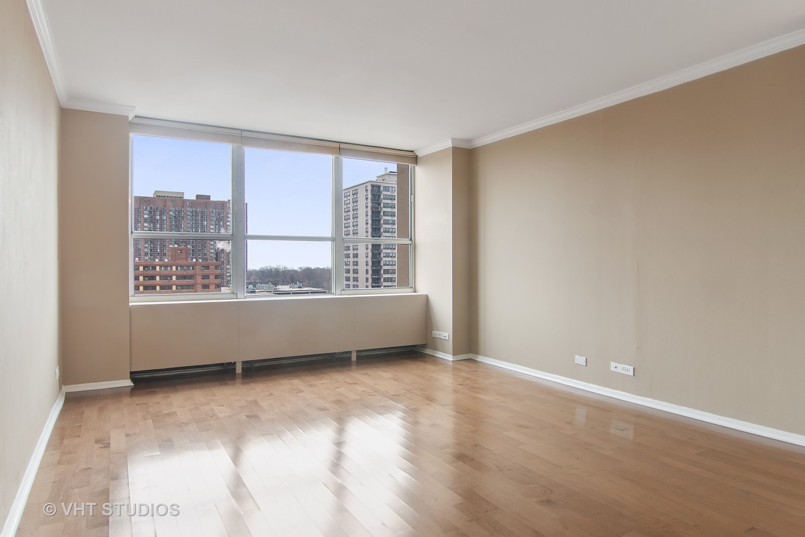 655 West Irving Park Road, Unit 910 Chicago, IL 60613 - Photo 8 of 14 a view of an empty room with a window
