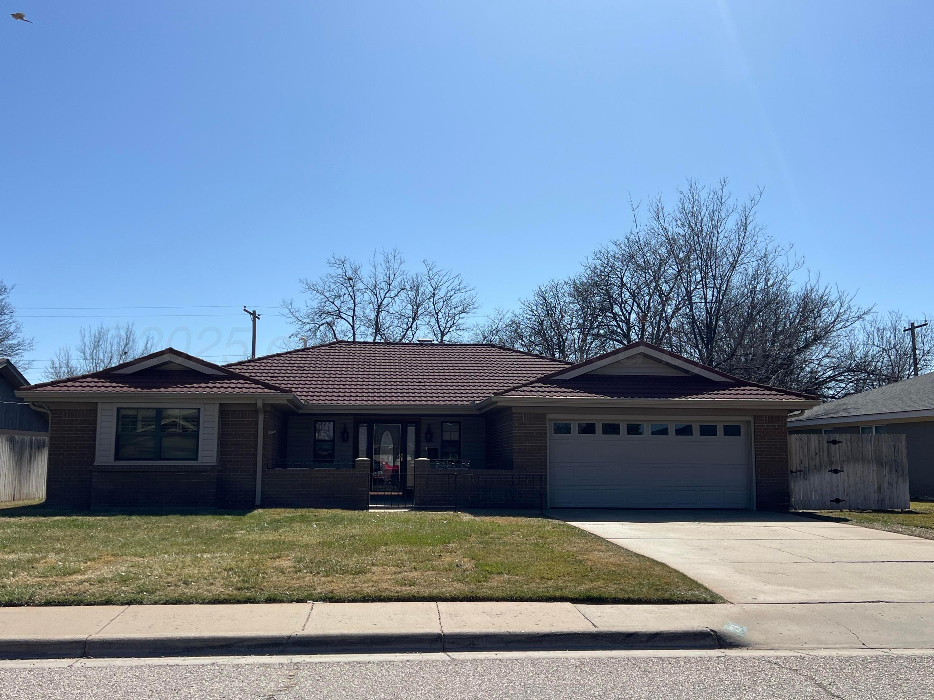 7115 Gainsborough Road Amarillo, TX 79106 - Photo 2 of 81 a front view of a house with a yard