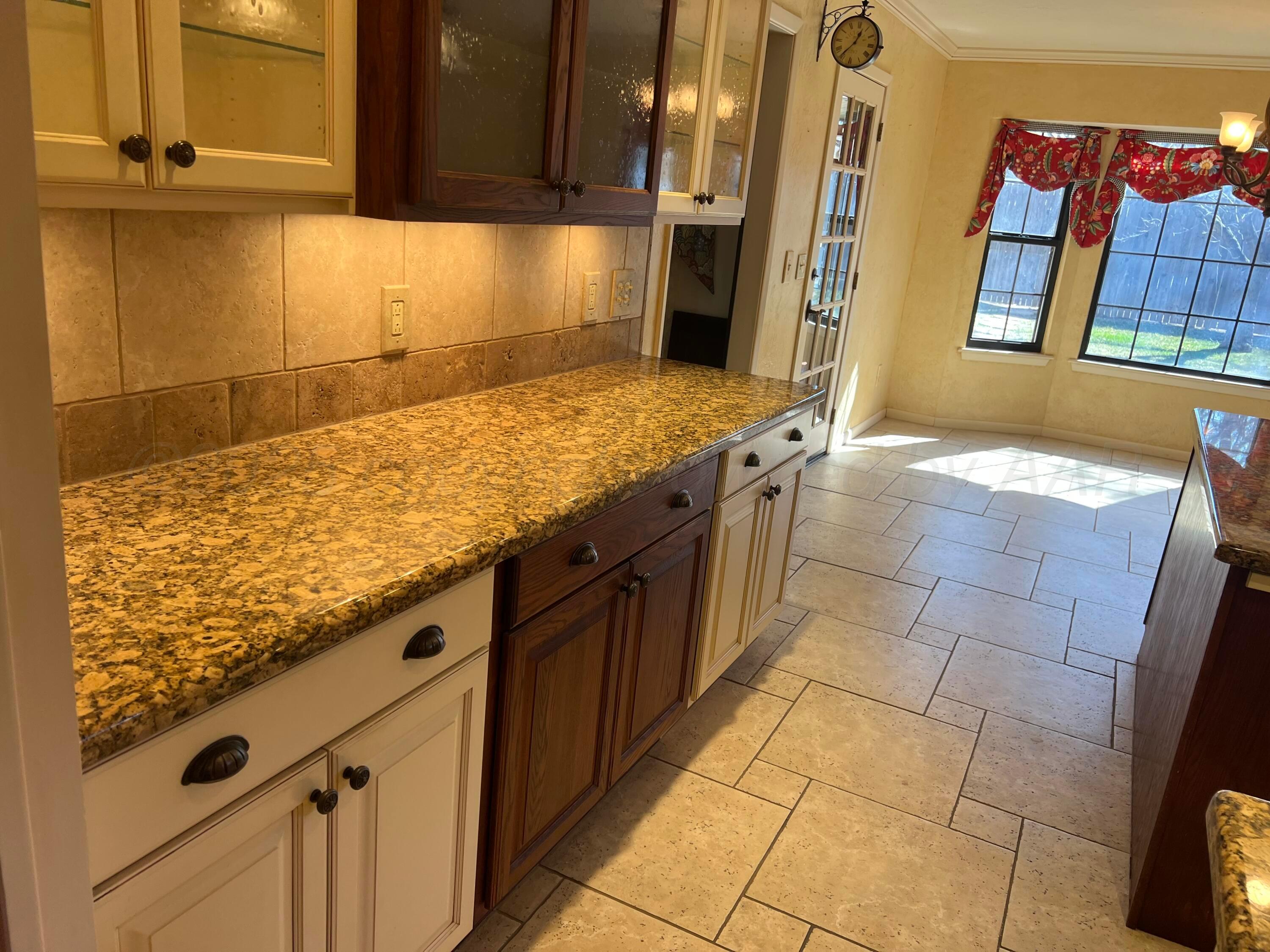 7115 Gainsborough Road Amarillo, TX 79106 - Photo 22 of 81 a view of a kitchen counter space and windows