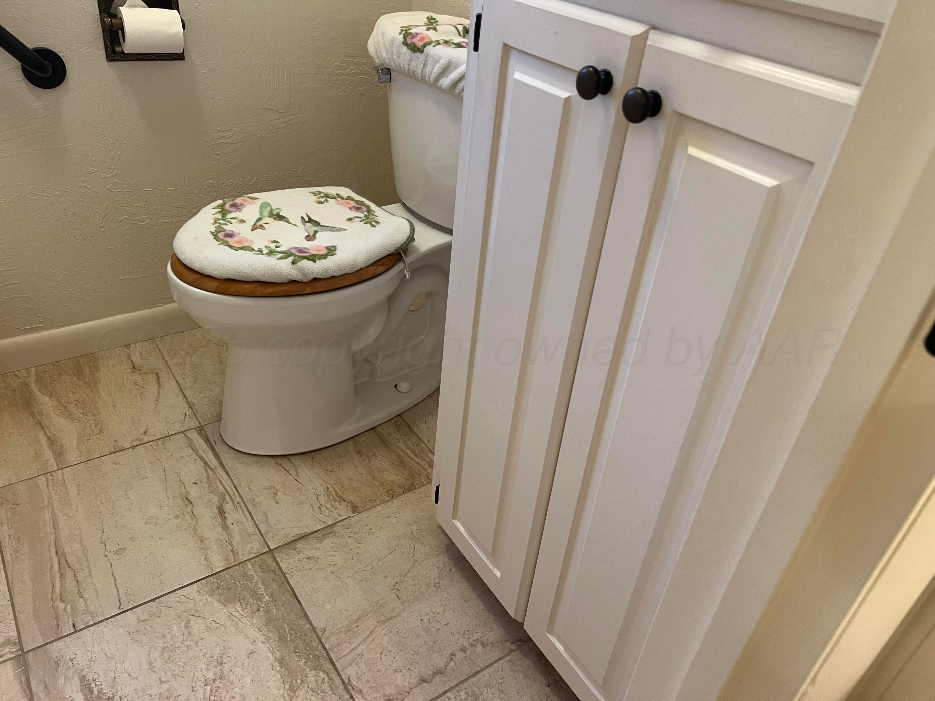 7115 Gainsborough Road Amarillo, TX 79106 - Photo 36 of 81 a view of a bathroom with a sink and a mirror