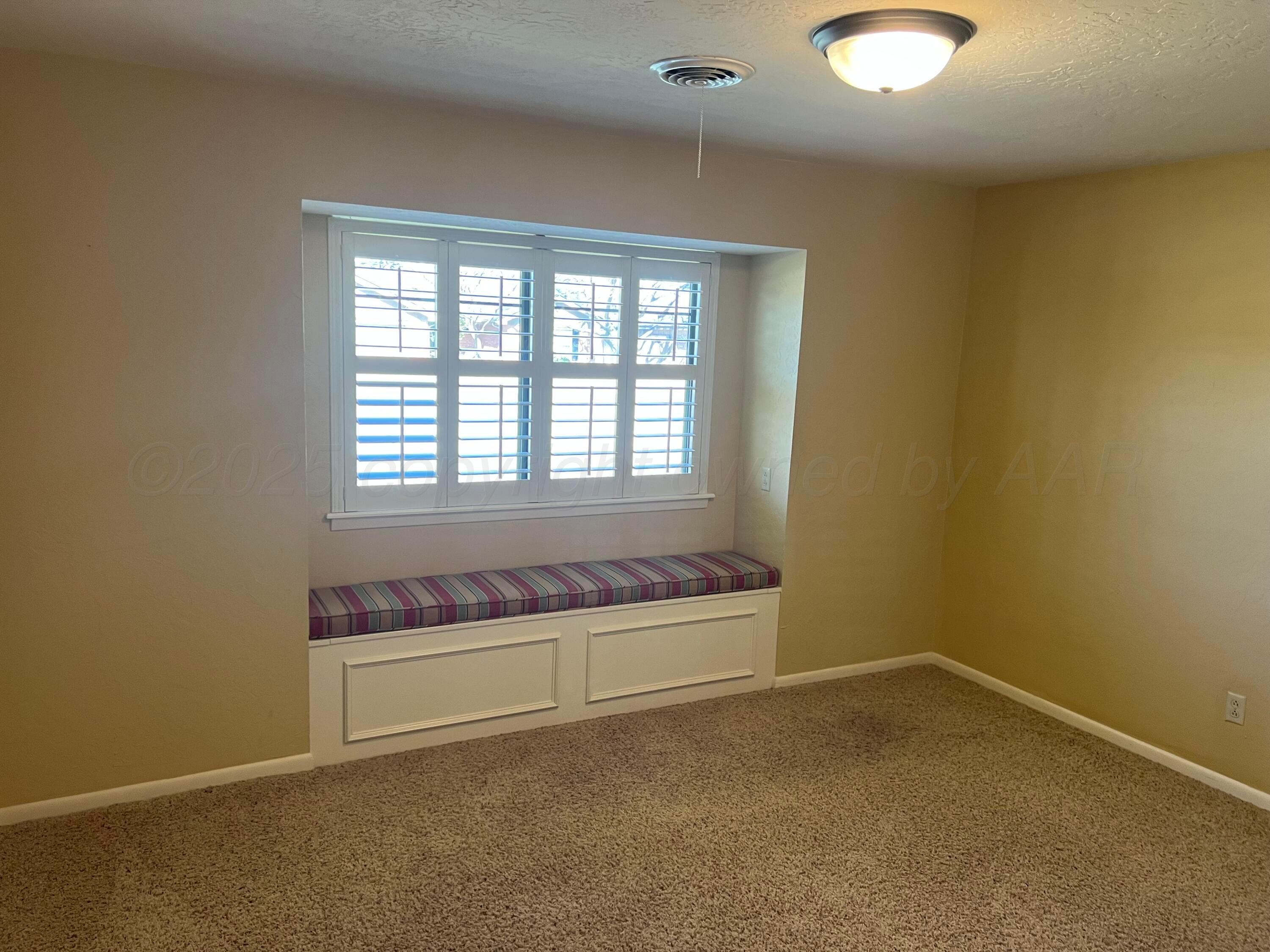 7115 Gainsborough Road Amarillo, TX 79106 - Photo 37 of 81 an empty room with a empty space and window