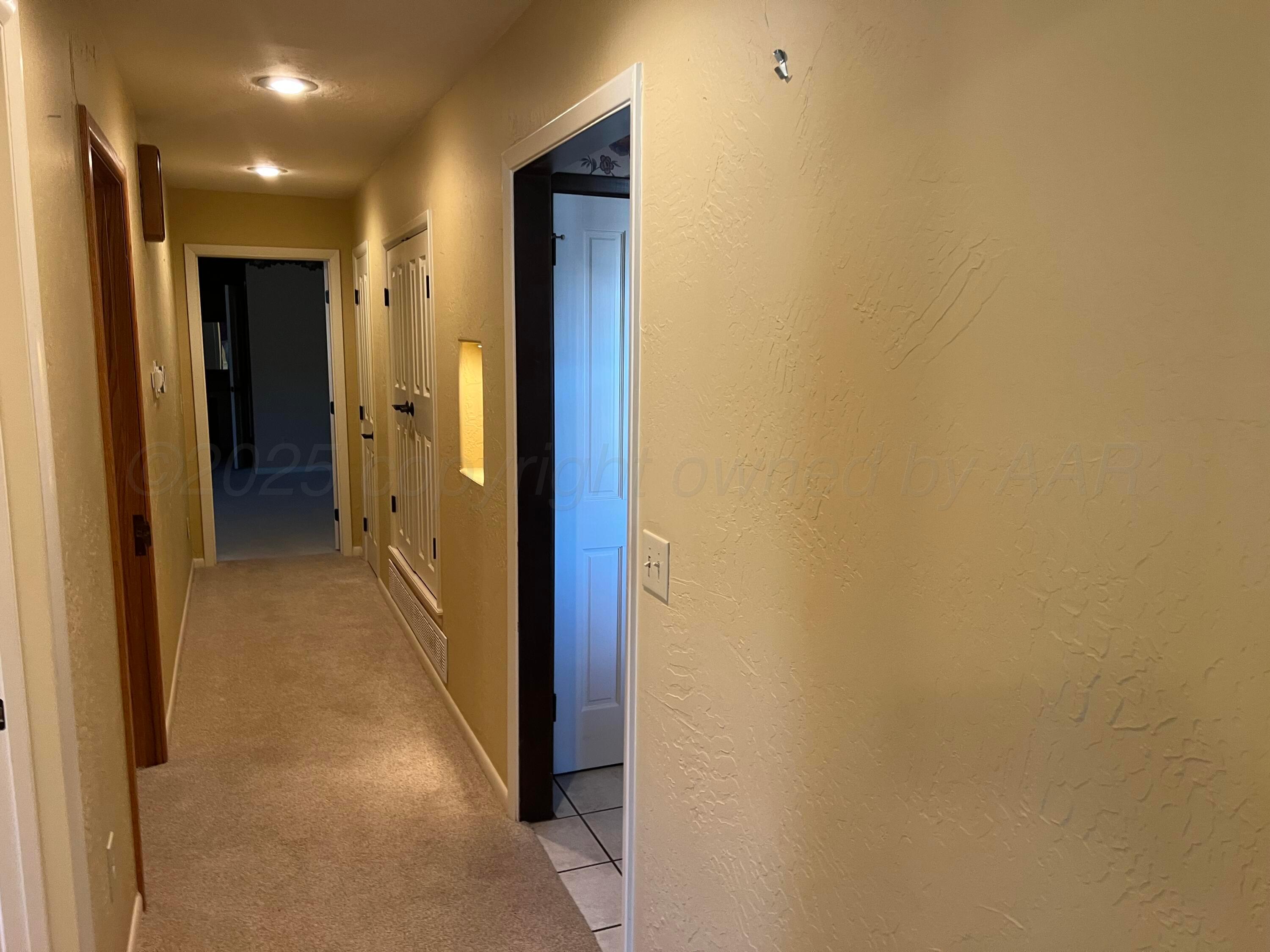 7115 Gainsborough Road Amarillo, TX 79106 - Photo 40 of 81 a view of a hallway with a room
