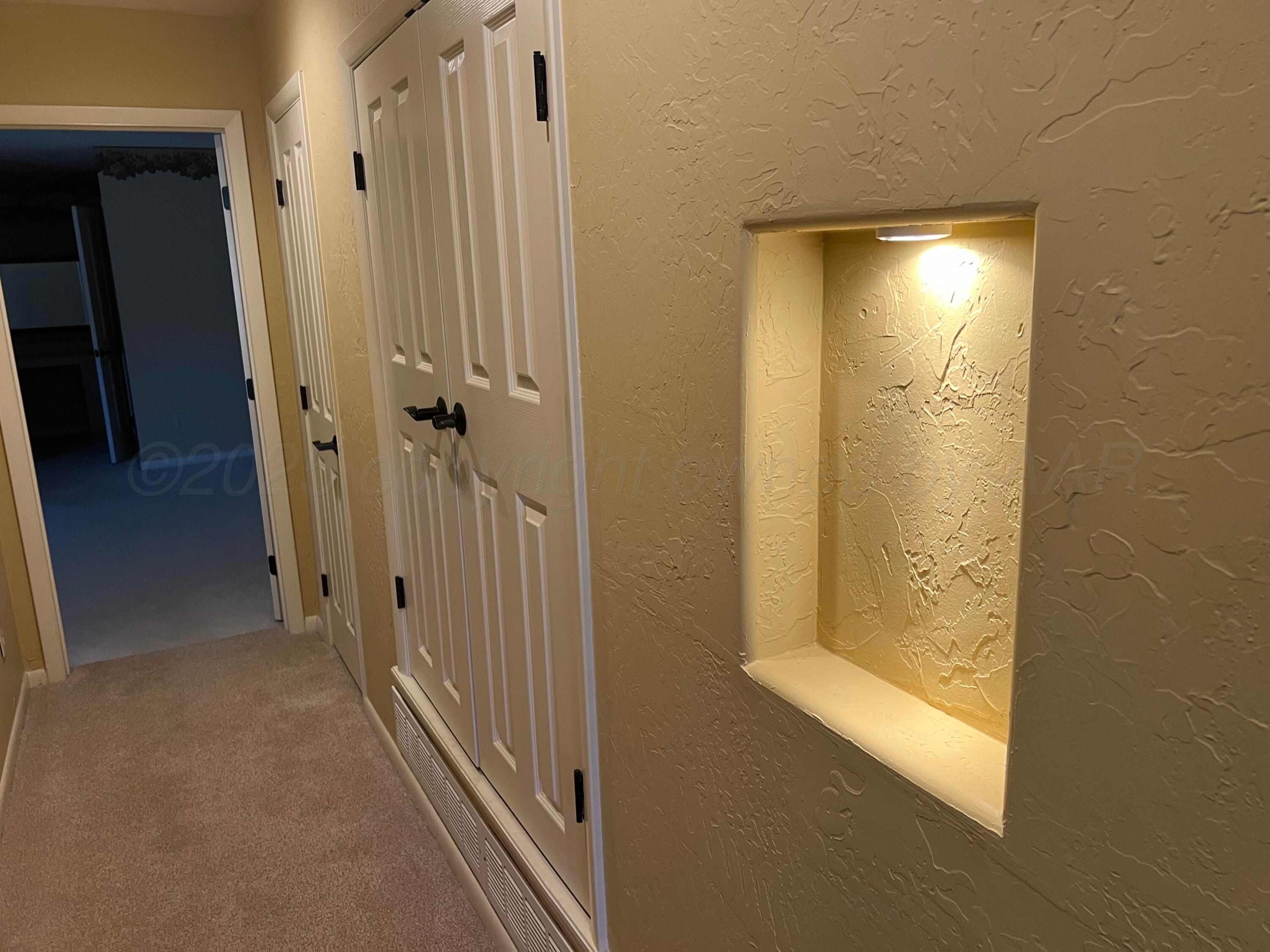7115 Gainsborough Road Amarillo, TX 79106 - Photo 41 of 81 a view of a bathroom from a hallway