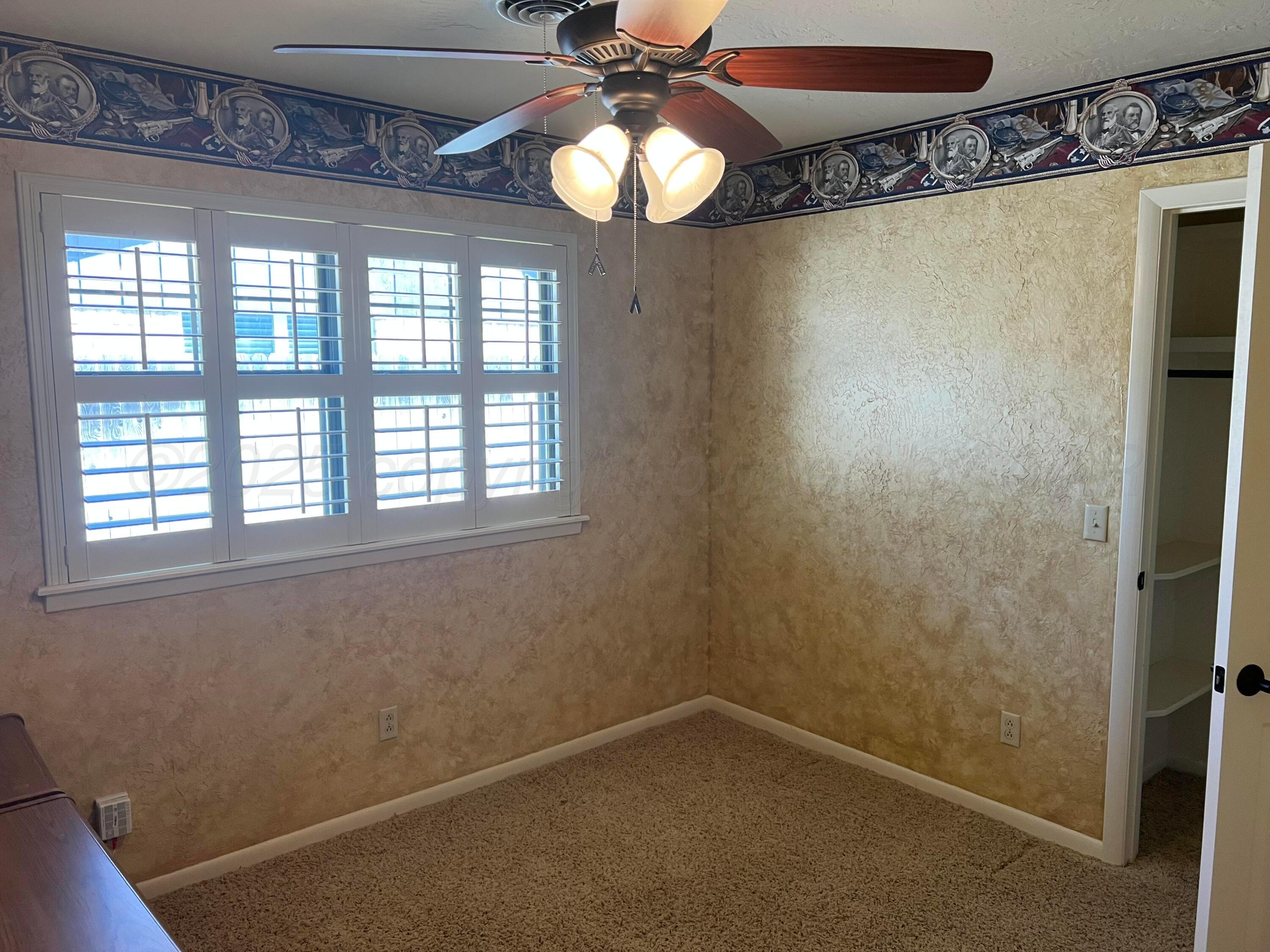 7115 Gainsborough Road Amarillo, TX 79106 - Photo 42 of 81 a view of an empty room with a window