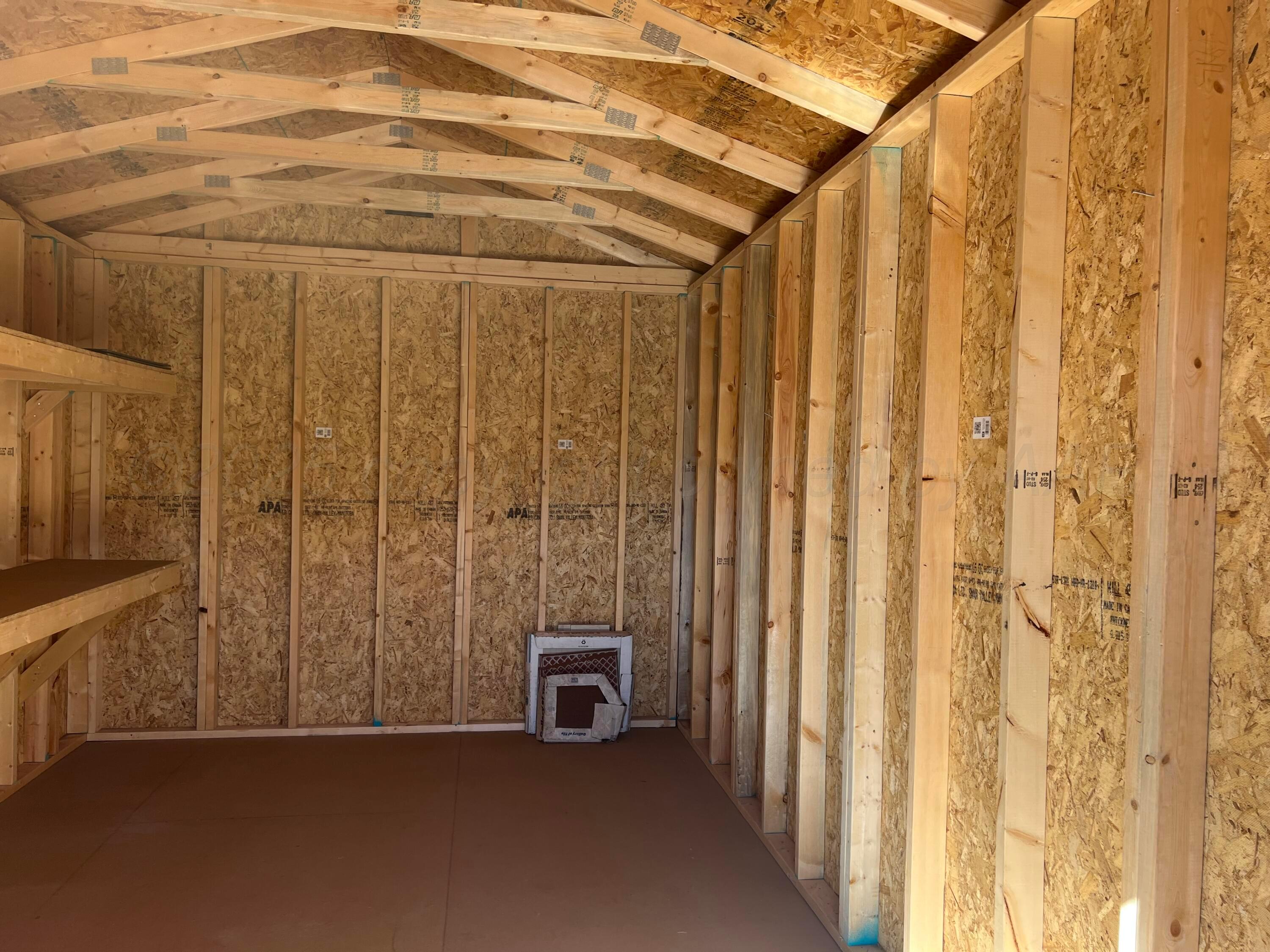7115 Gainsborough Road Amarillo, TX 79106 - Photo 77 of 81 a view of a room with a door and wooden walls