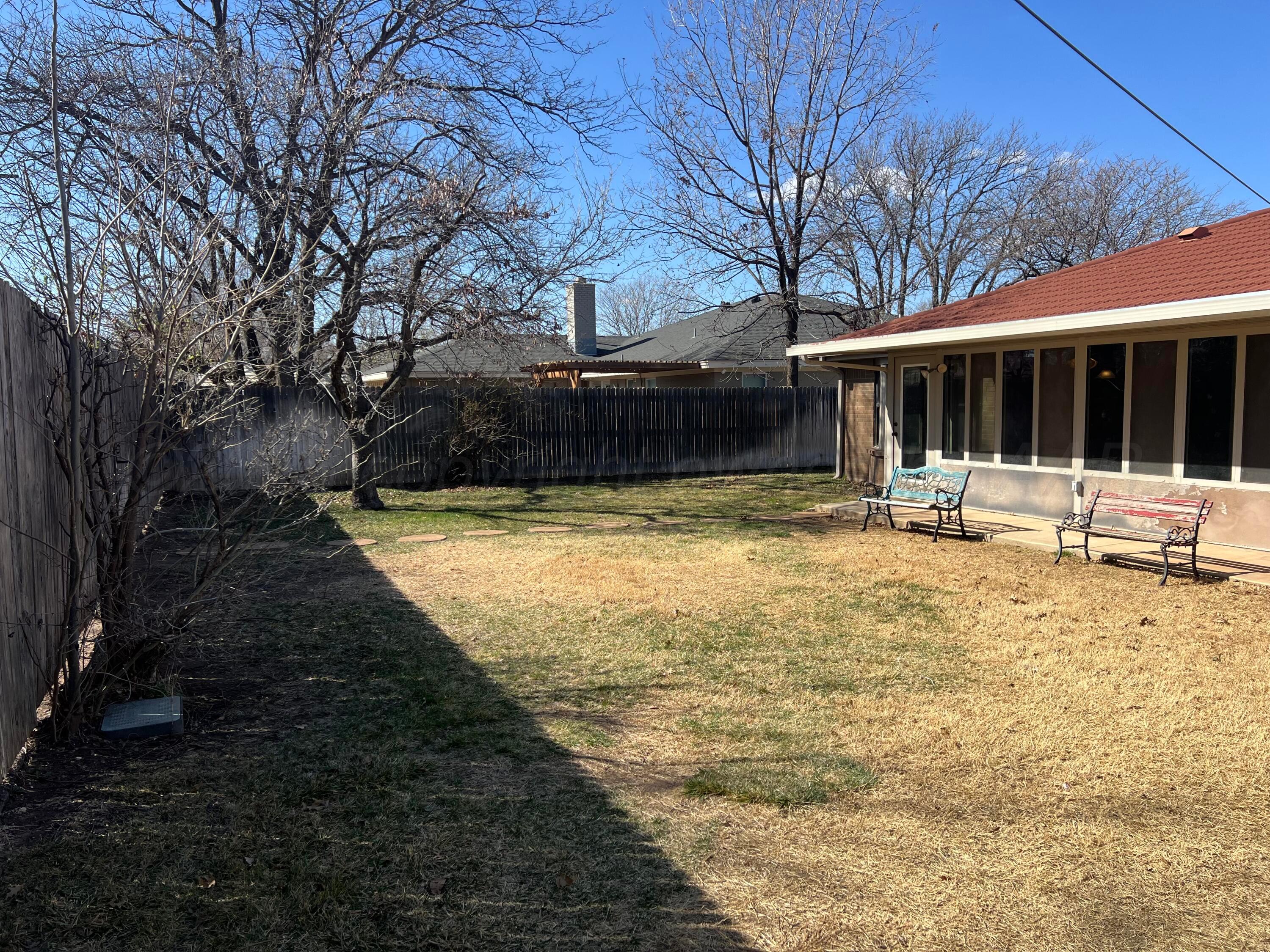 7115 Gainsborough Road Amarillo, TX 79106 - Photo 79 of 81 a view of a house with backyard and sitting area