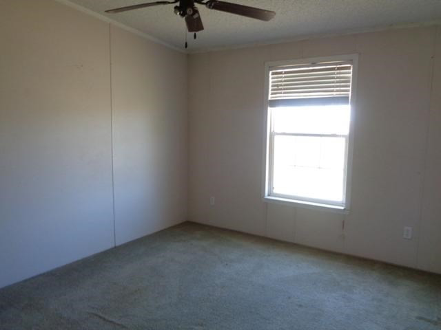 1723 Owl Road Lubbock, TX 79407 - Photo 13 of 18 an empty room with a window