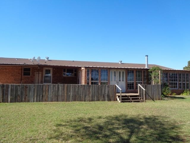 1723 Owl Road Lubbock, TX 79407 - Photo 16 of 18 a view of a backyard with furniture