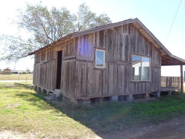 1723 Owl Road Lubbock, TX 79407 - Photo 18 of 18 a backyard of a house with garden and deck