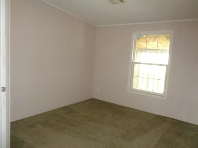 1723 Owl Road Lubbock, TX 79407 - Photo 10 of 18 an empty room with a window
