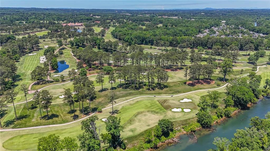 3712 Frederica Road Northwest Berkeley Lake, GA 30096 - Photo 46 of 49 an aerial view of residential houses with outdoor space and trees