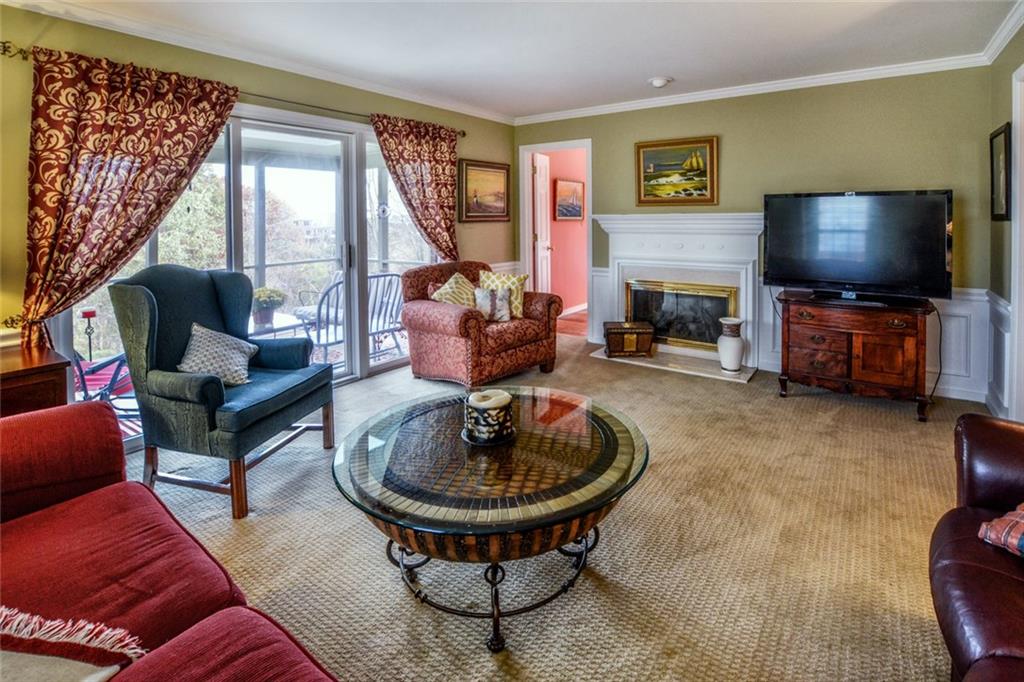 214 Sweet Gum Road Pittsburgh, PA 15238 - Photo 12 of 24 Gas fireplace makes room cozy in fall and winter months, while view of the outside from the wall of glass provided by sliding doors.