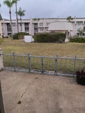 an empty room with windows and entrance